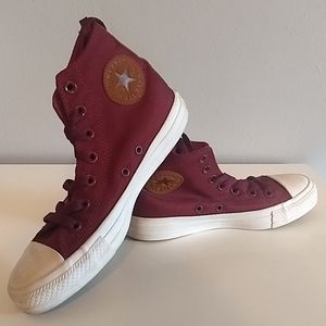 Dark red high top chucks with suede detailing